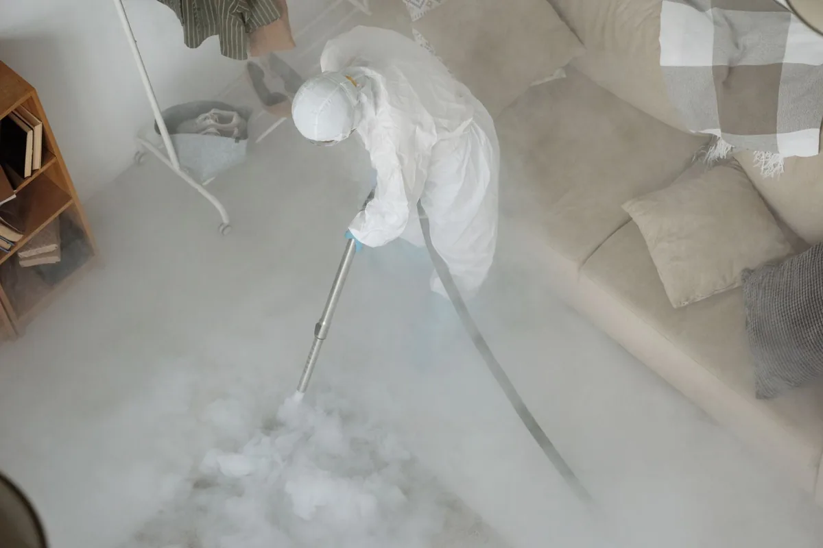 Biohazard cleanup technician in protective equipment, Lathrop, CA
